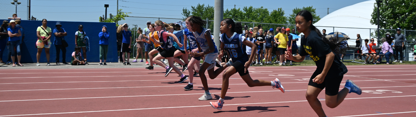 young girls running on a track