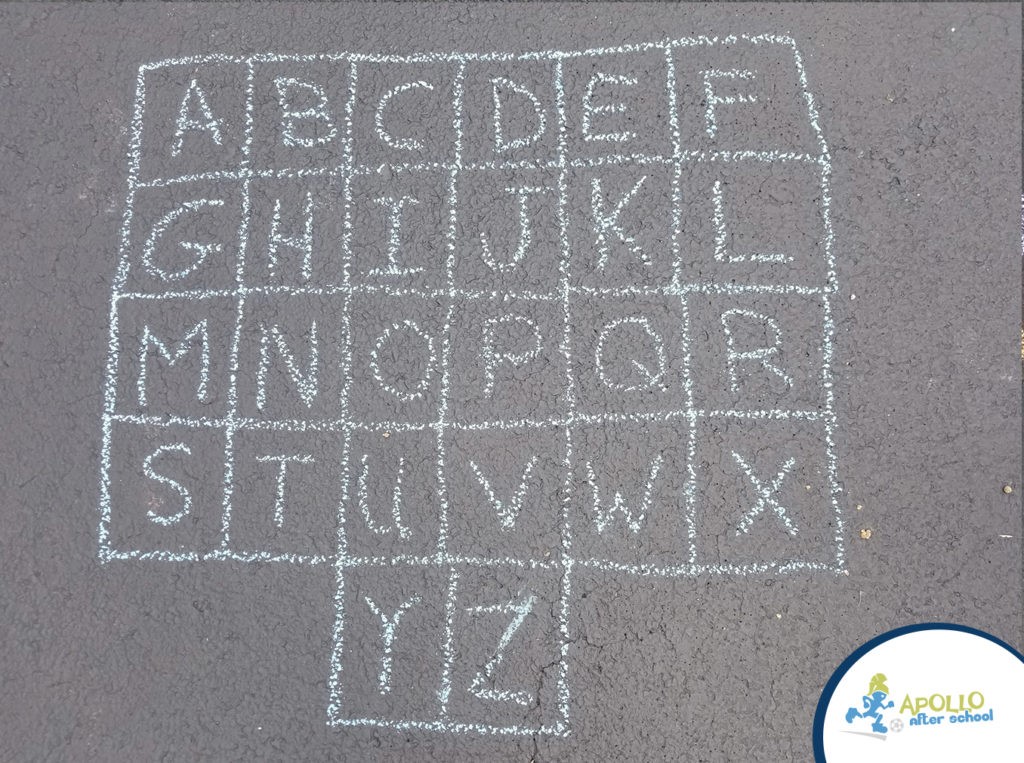 Alphabet drawn out on chalk on a driveway