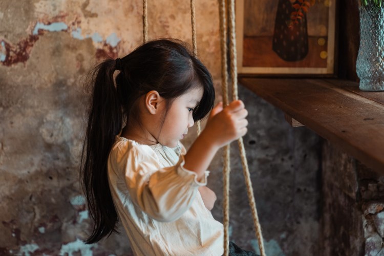 photo of a girl on a swing