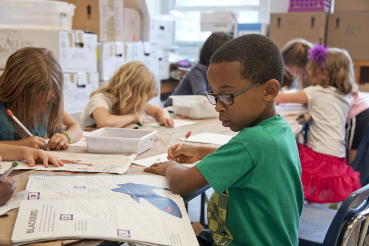 photo of students at their desks studying