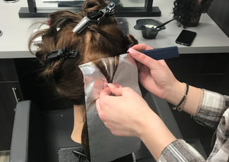 Cassidy styling mannequin hair at OYAP placement
