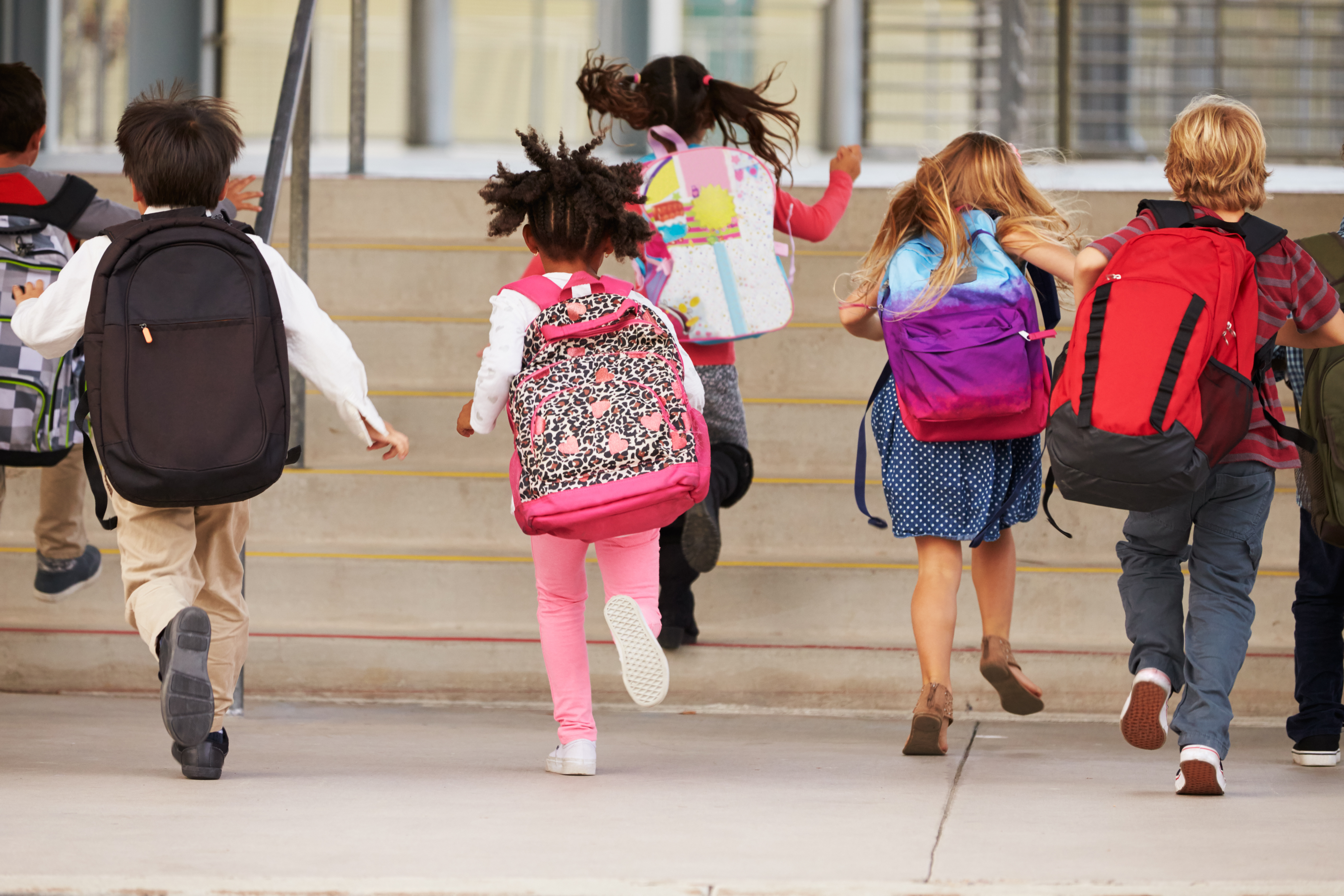 Students running into school