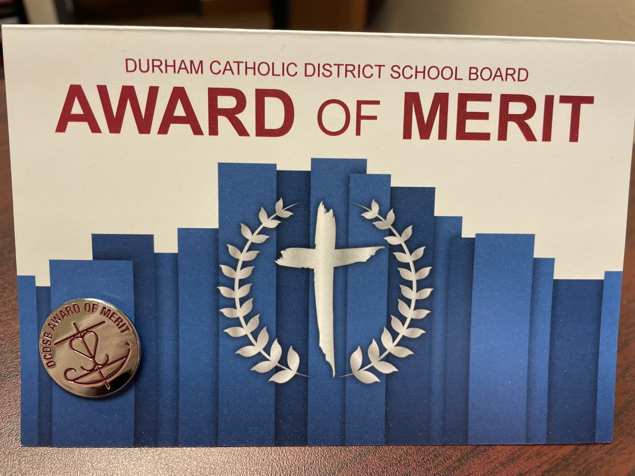 Award of Merit card and pin