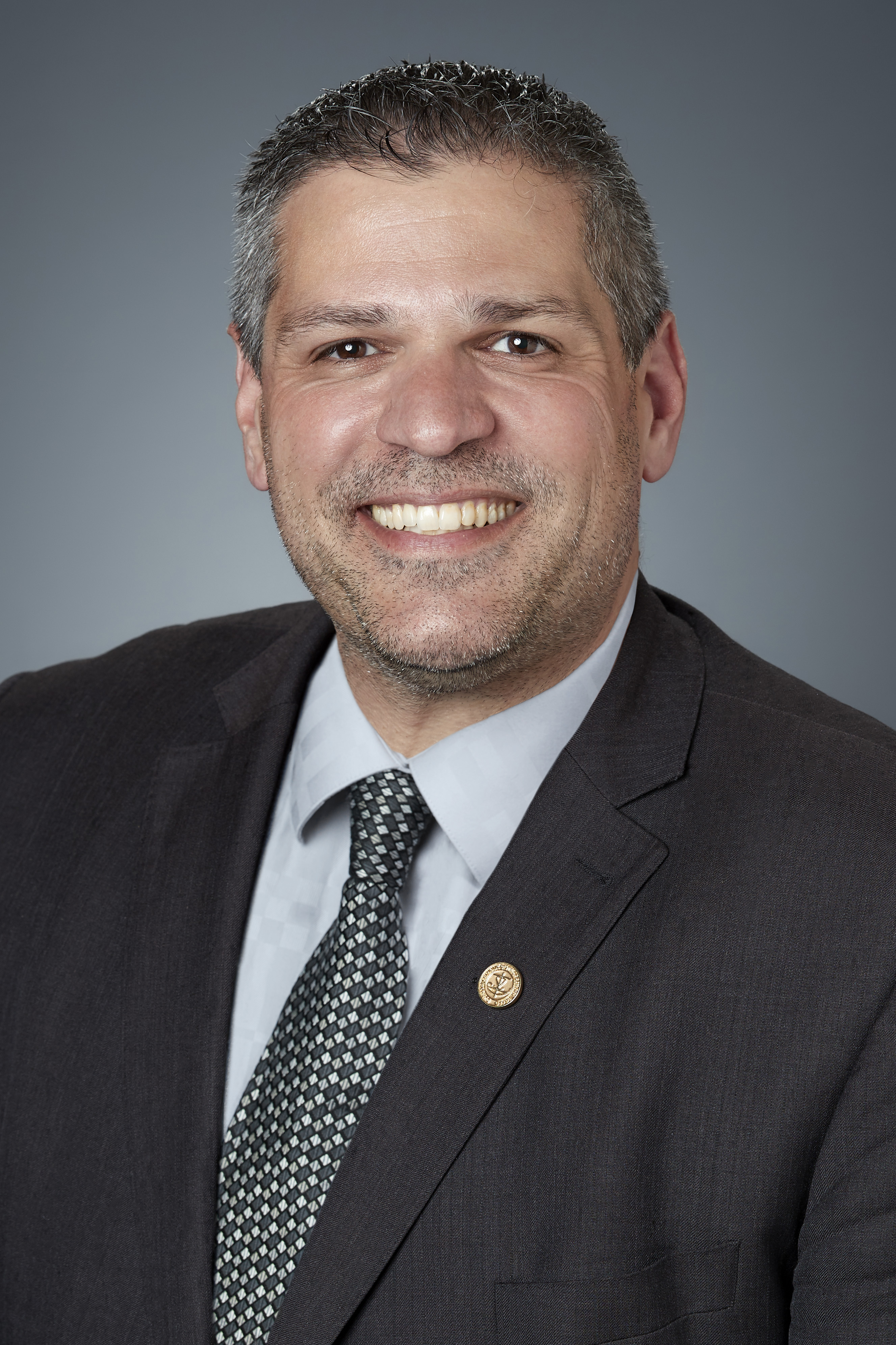 Photograph of a man smiling