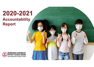 Two female and two male students wearing masks and giving thumbs up