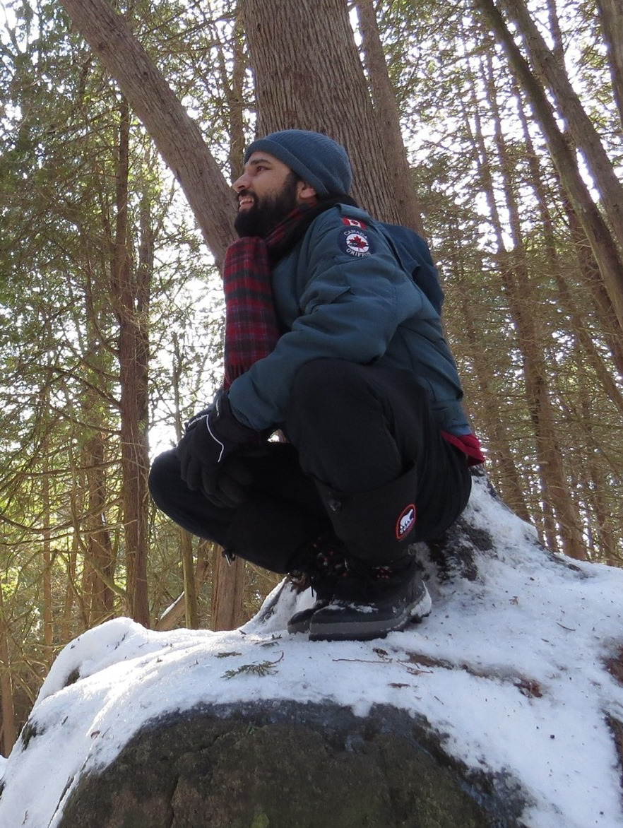 Male adult outside in the snow and nature