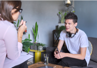 Male student talking to a female adult