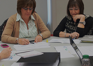 Two female adults in a team meeting