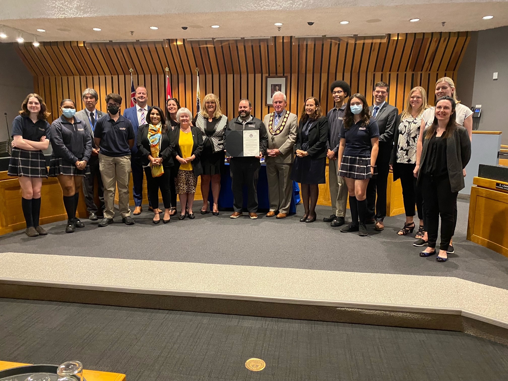 Students and staff from All Saints accept award from Town of Whitby Mayor and Council