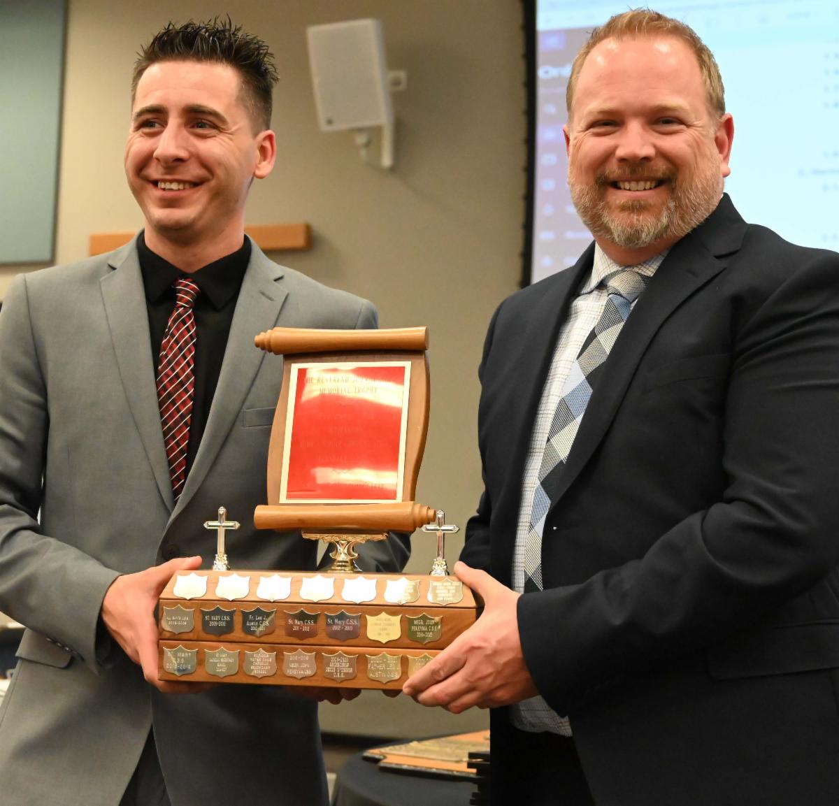 Trustee presenting the Rev John Markle Award to secondary principal