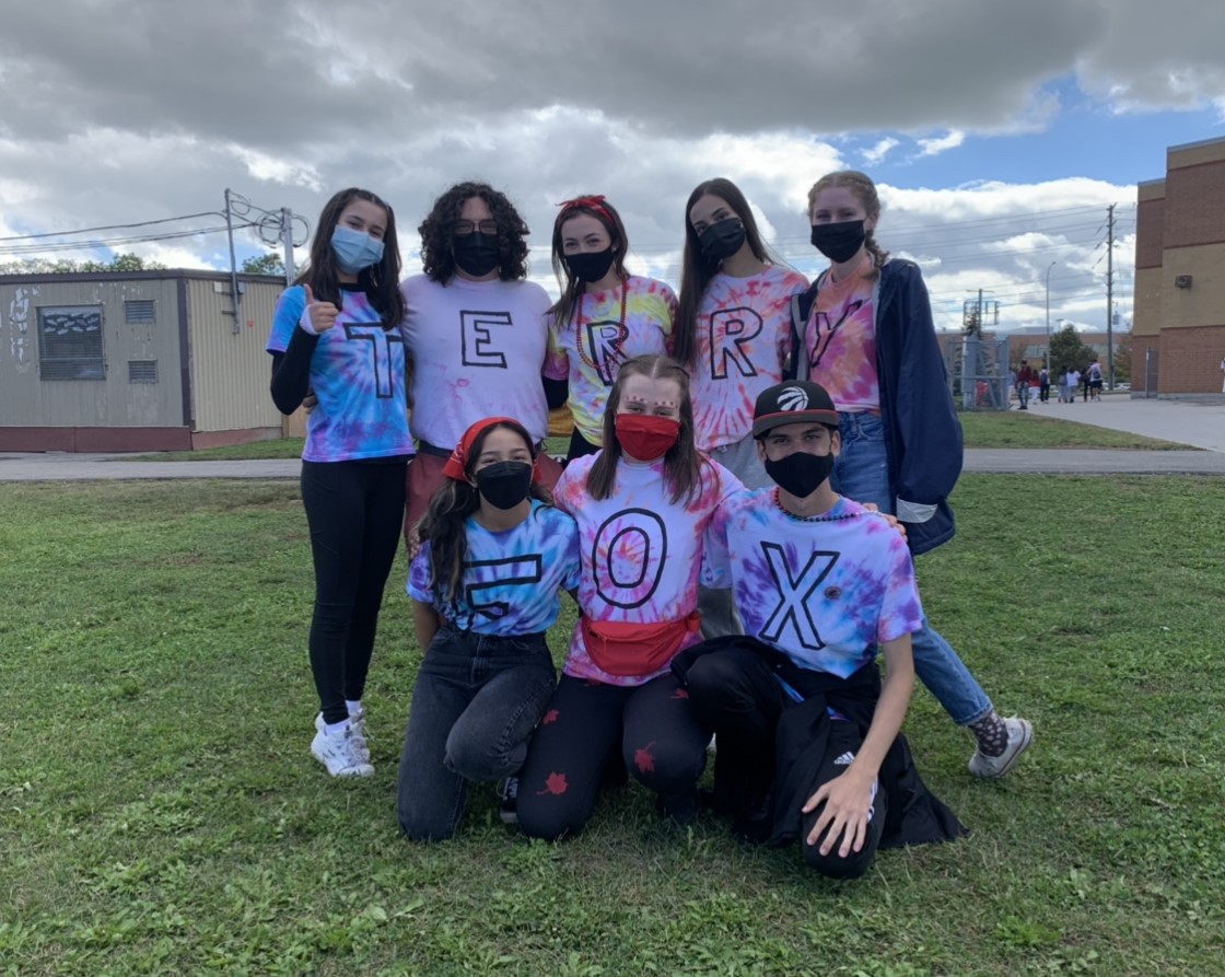 Students wearing t-shirts that spell out Terry fox