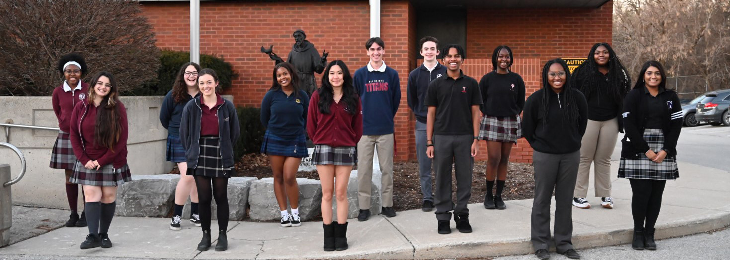 Group of students wearing their school uniforms outside