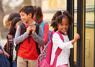 Students going on a school bus