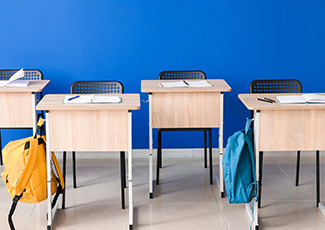 Empty desks in a classroom