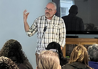 Adult male speaking to an audience