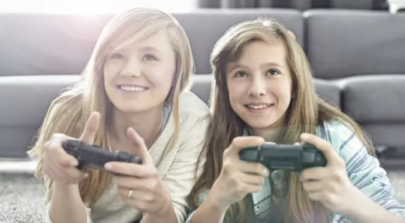 2 teen girls playing video games
