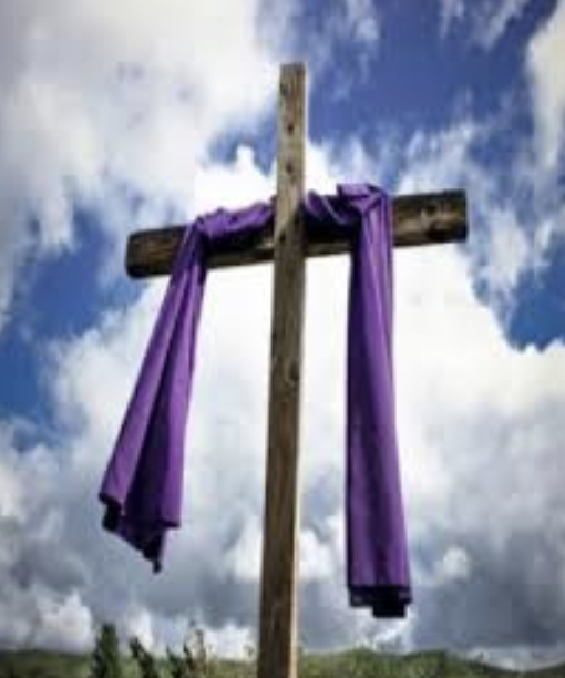 a cross draped in purple cloth
