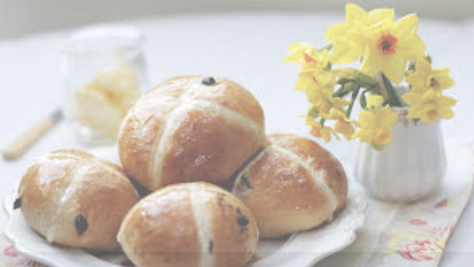 hot cross buns on a white plate