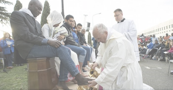 Pope washing people's feet