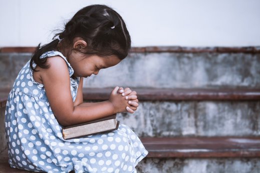 young girl praying