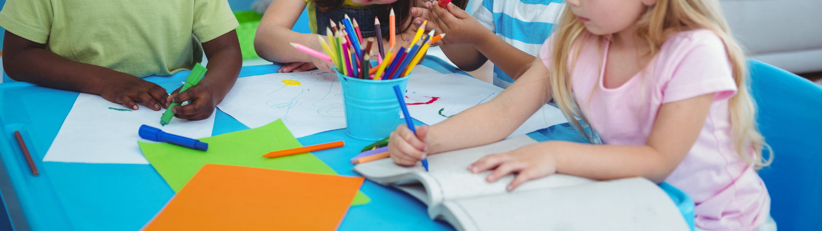 Students drawing at a table