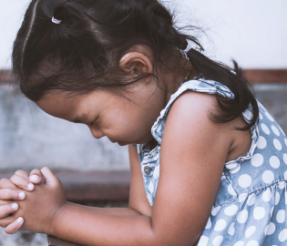 Young girl praying