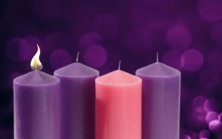 First purple candle lit for the first Sunday of Advent