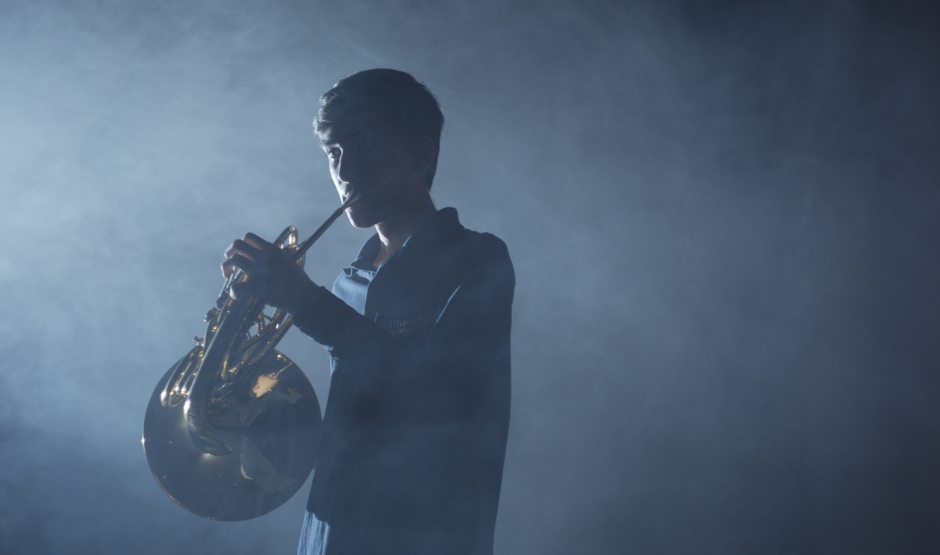 Teen boy playing a tuba