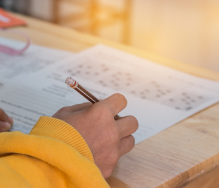 Students hand writing on paper