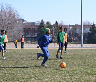 Boy kicking a soccer ball