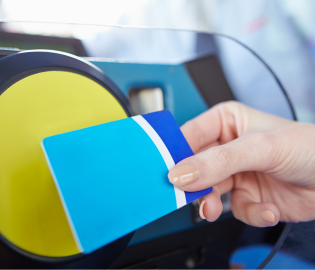 person tapping card on reader