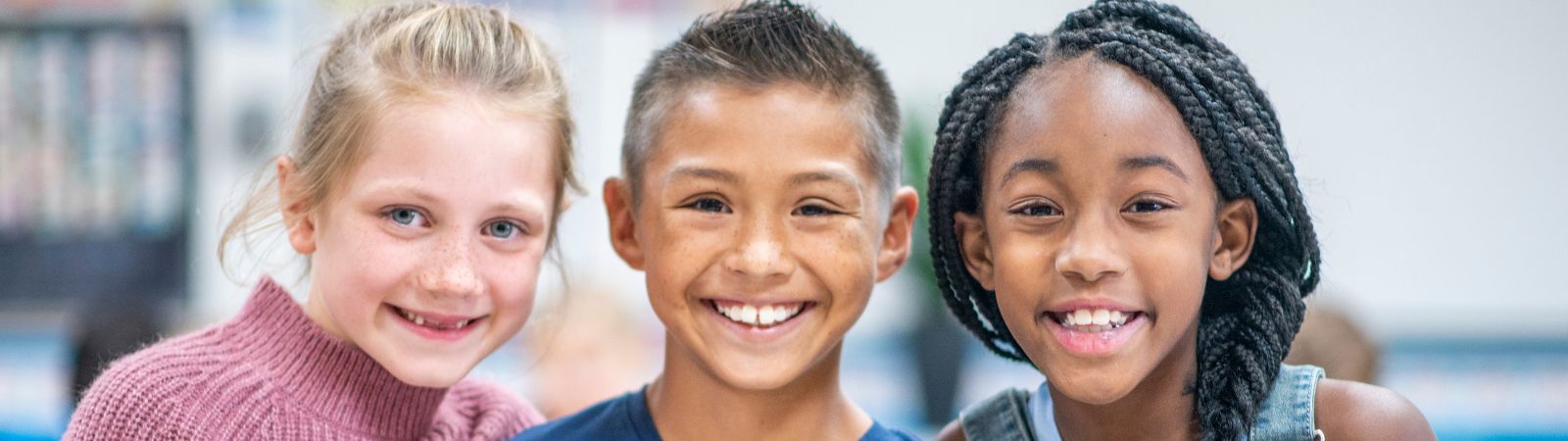 three students smiling