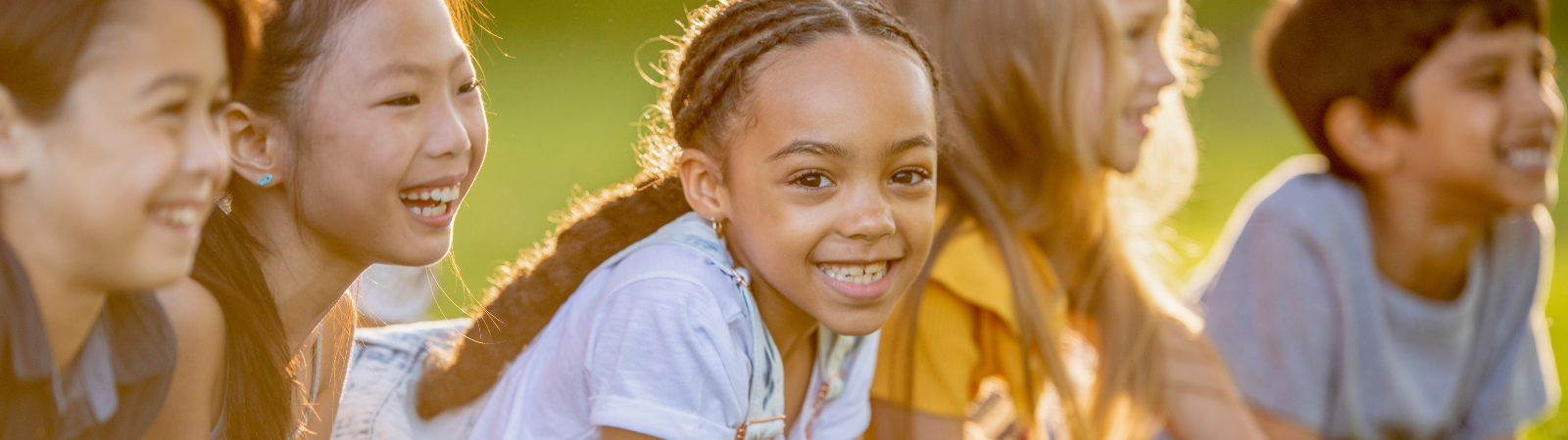 kids outside smiling