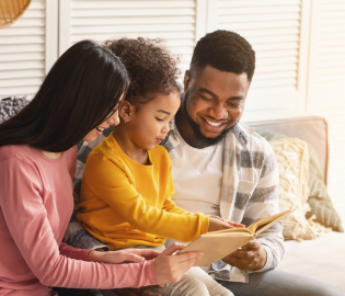 Family reading on the couch