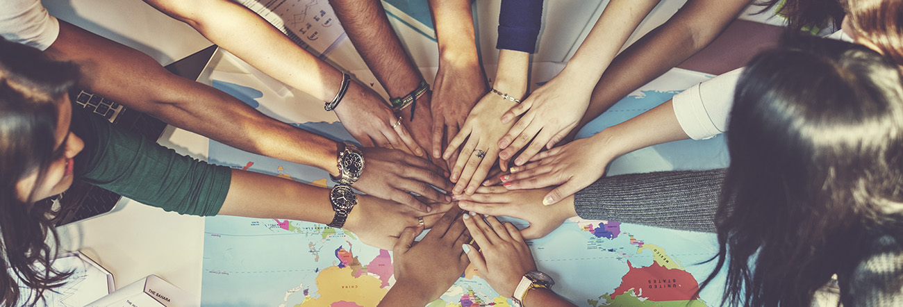 Hands coming together forming a circle