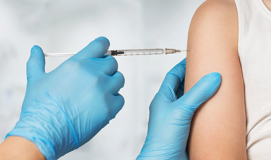 needle being injected into an arm