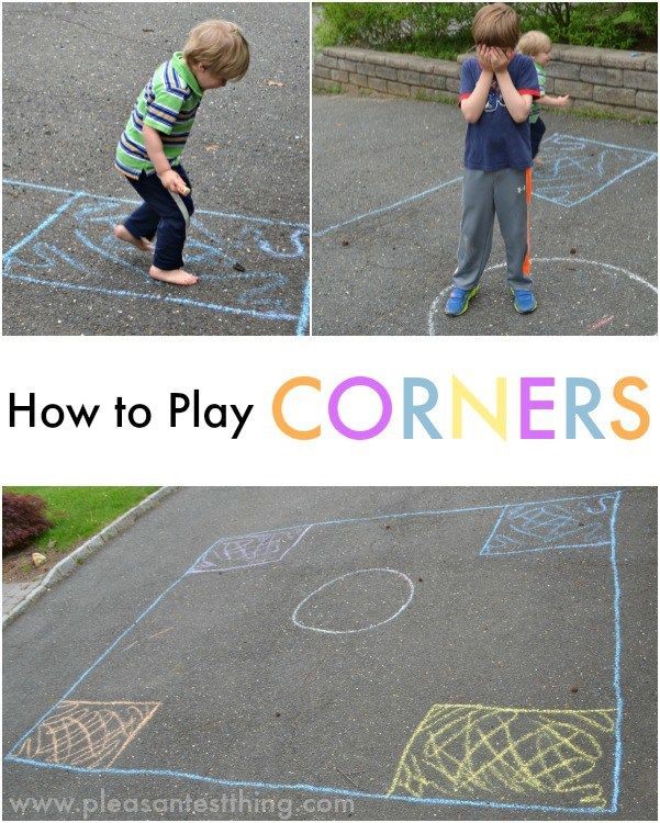 Young boys standing on corner of a box drawn with chalk on a driveway