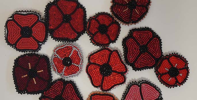 red beaded poppies made by Indigenous artist