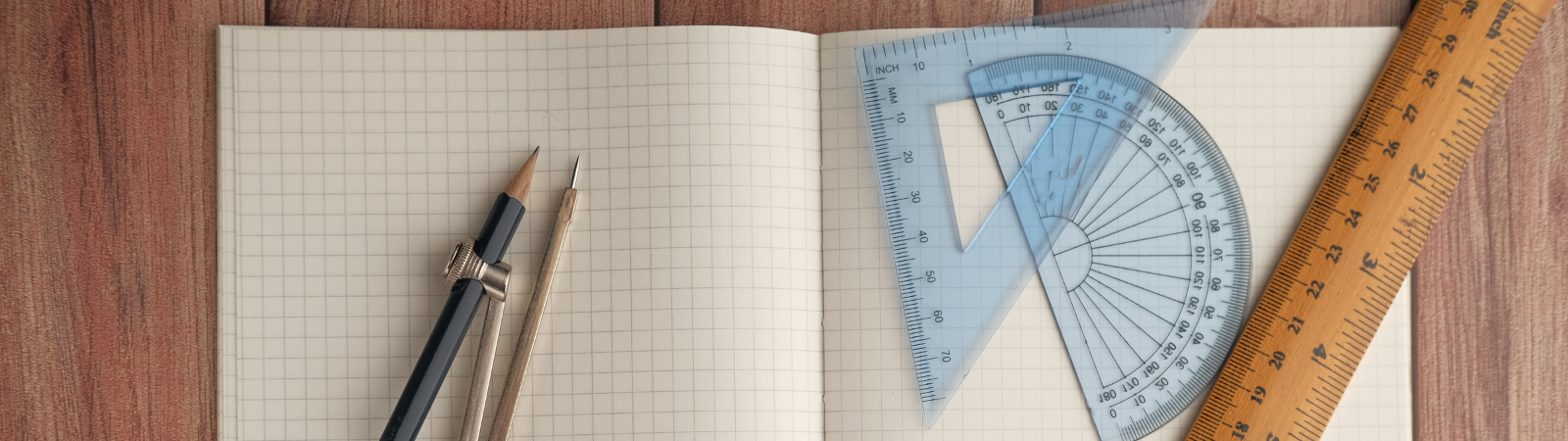 a notebook with a ruler and a pencil