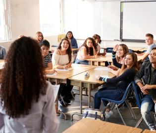 A classroom of students smiling