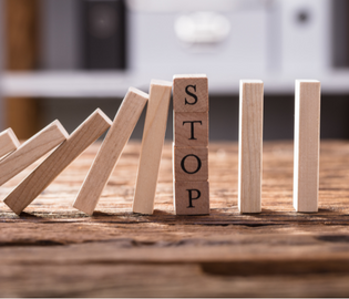 dominos with stop written on the middle piece