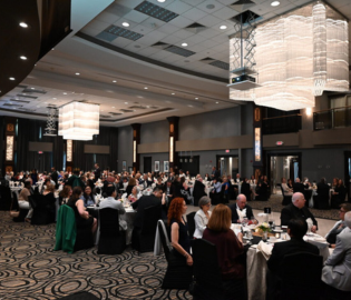 Photo of the Gala room, where guest sit at their dinner tables