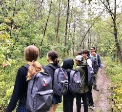 students standing in the forest