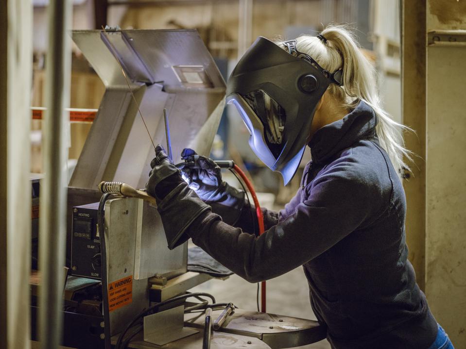 Female adult welding