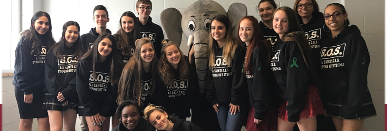 Group of male and female students wearing SOS hoodies for Mental Health Awareness