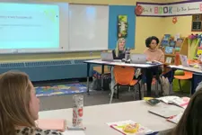 teachers sitting at tables