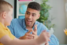 Teacher speaking with a student