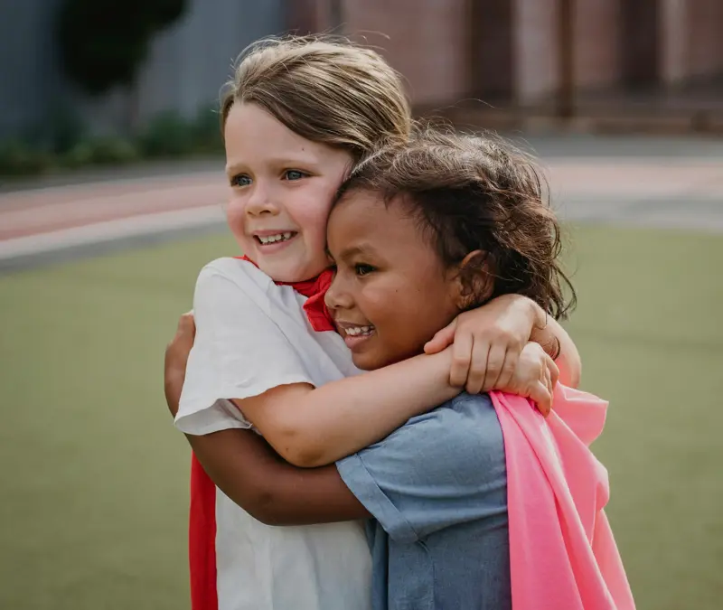 two students hugging