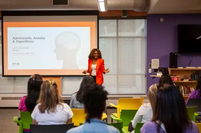 Presenter in front of a crowd