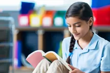 student reading book